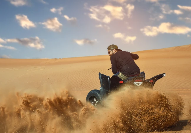 Evening Desert Safari with Quad Bike, Dune Bashing, Sandboarding, Camel Ride, Dinner & More